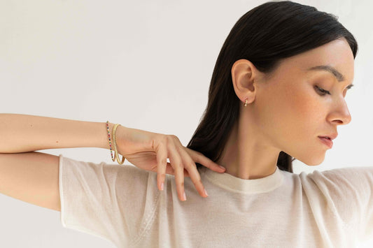 woman wearing diamond tennis jewelry