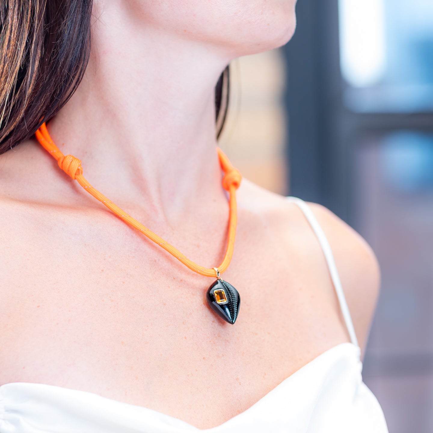 Dezso Orange Cord Necklace with Medio Onyx Cowry Charm with Citrine