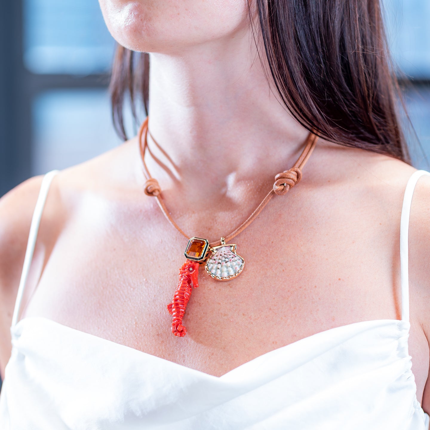 Dezso Leather Cord Necklace with Coral Seahorse Charm with Citrine and Natural Clam Shell Charm