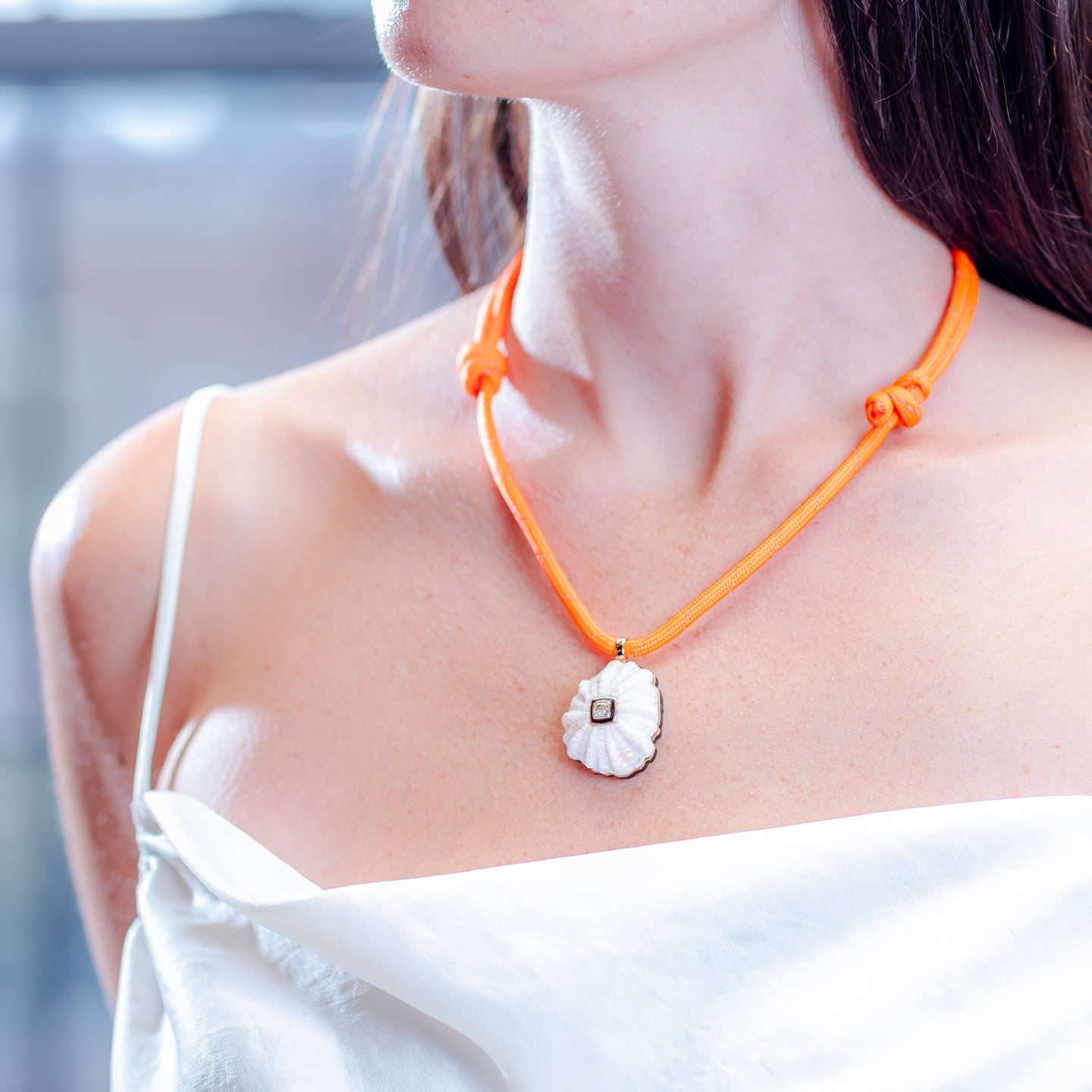 Dezso White Coral Barnacle Charm with Cushion Diamond and Black Enamel on Orange Cord Necklace